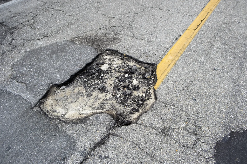 Image of a pothole on a road